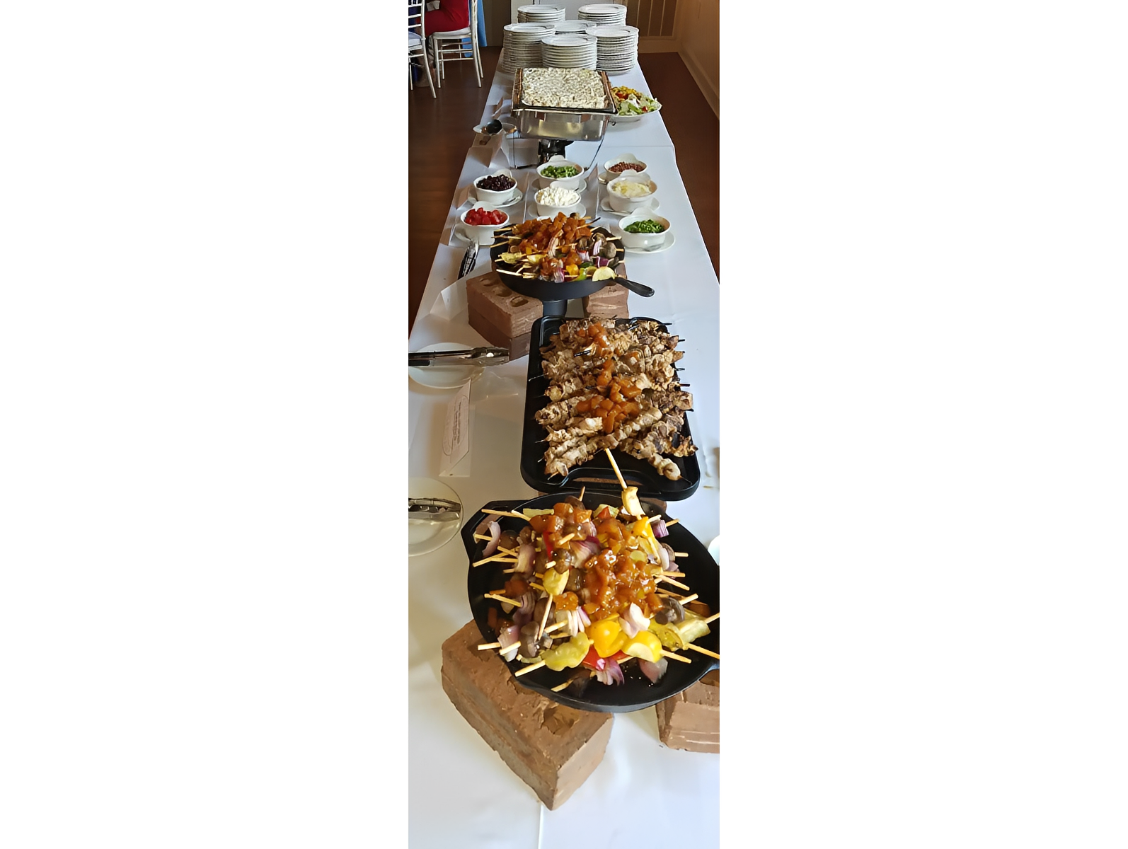 Colorful buffet arrangement with plates and dishes