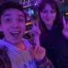 Happy duo posing with peace signs