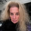 Serious expression with wavy hair