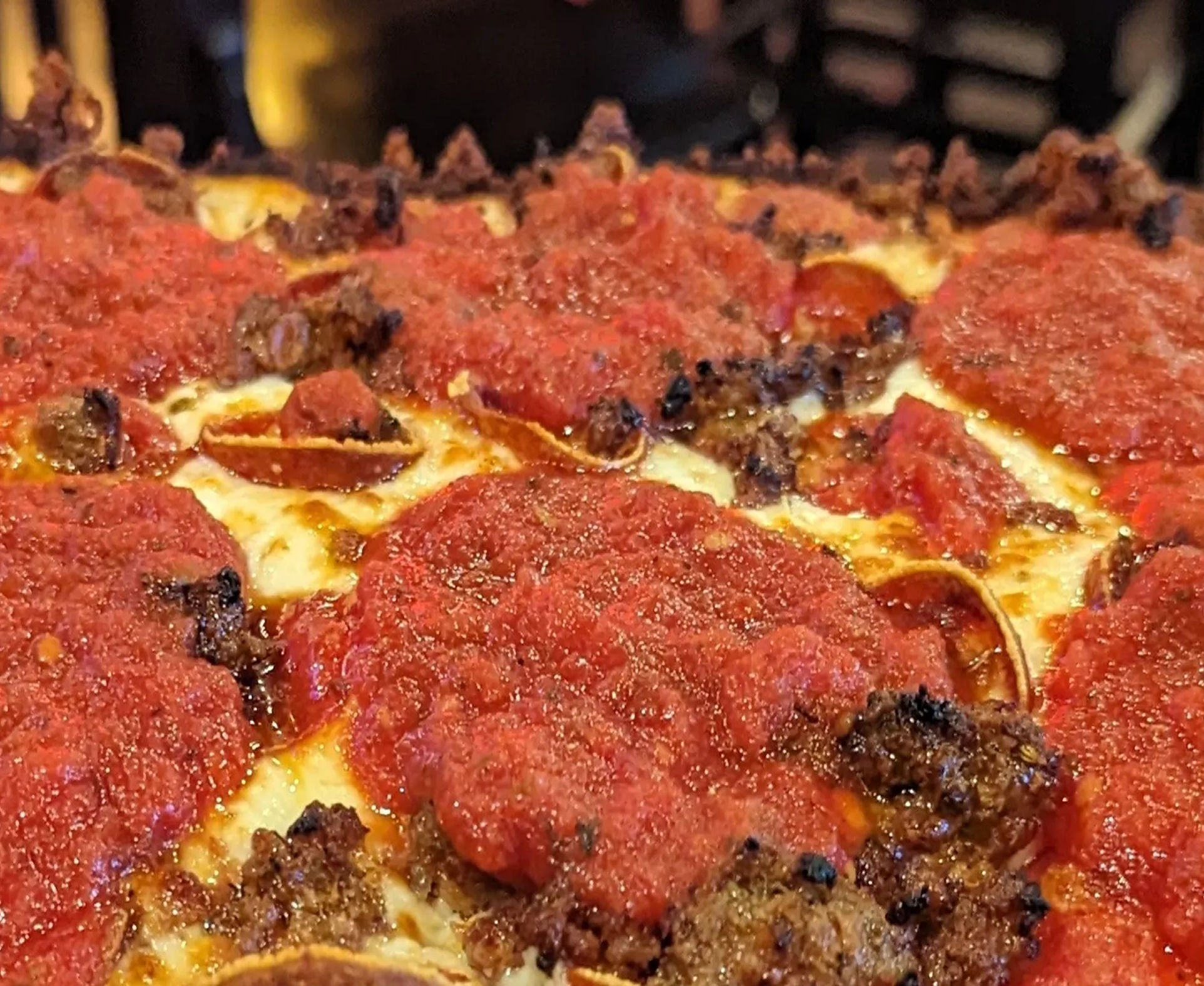 Deep-dish pizza with rich tomato sauce