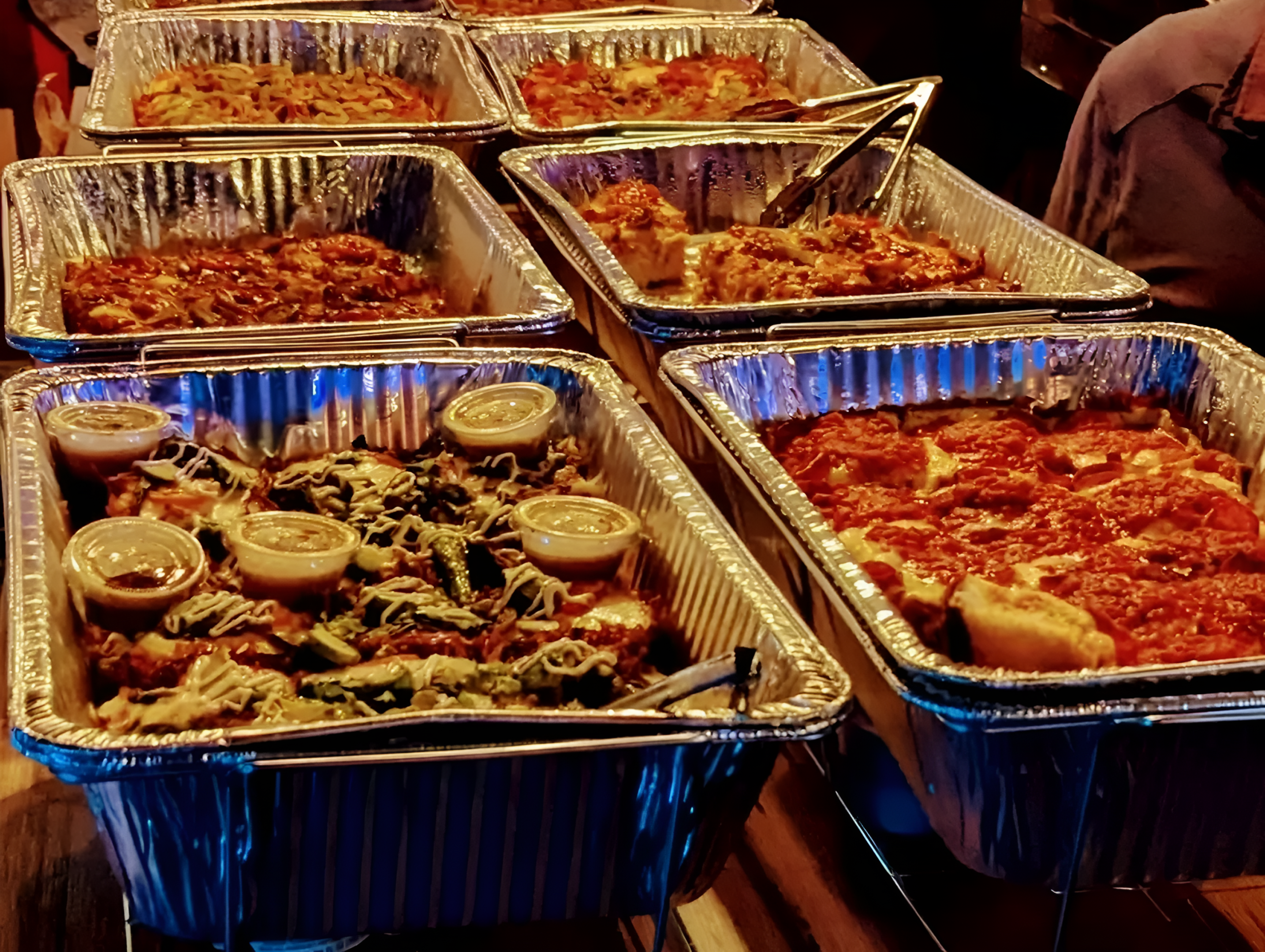 Catering trays filled with Italian dishes