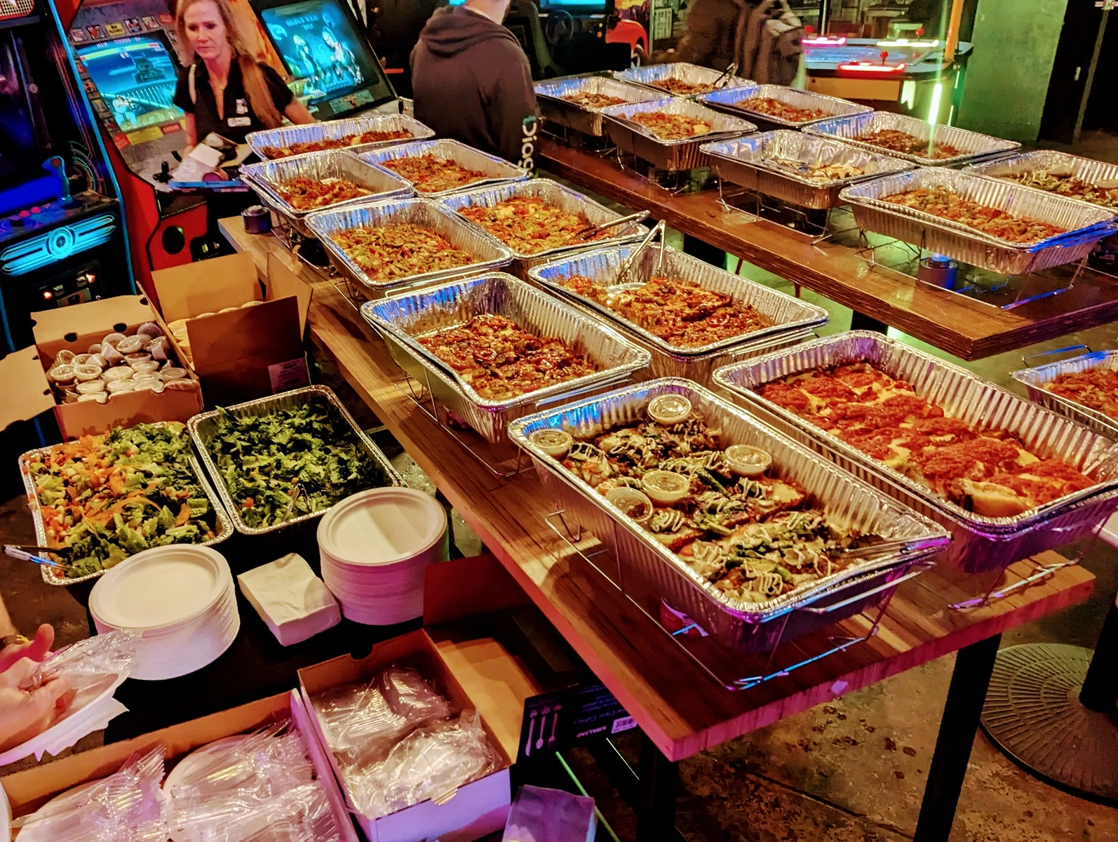Buffet table with assorted food trays